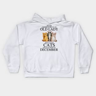 Never Underestimate An Old Lady Who Loves Cats December Kids Hoodie